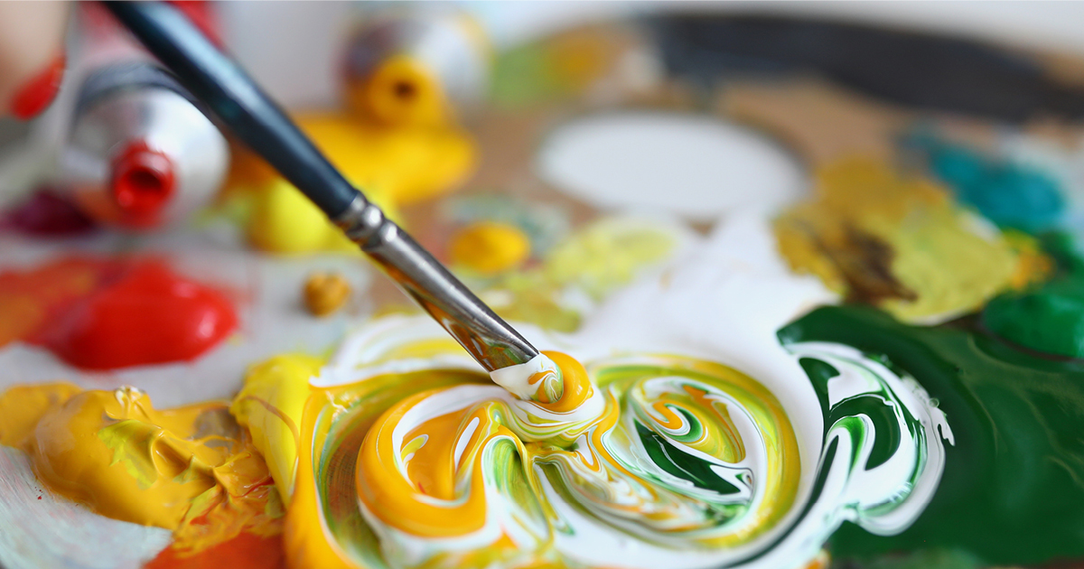 A paintbrush mixing paint A paintbrush mixing paint