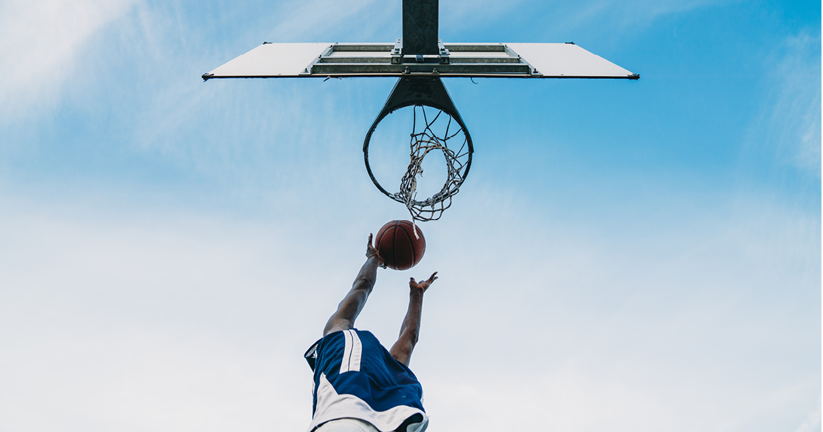 Basketball player shooting a hoop Basketball player shooting a hoop